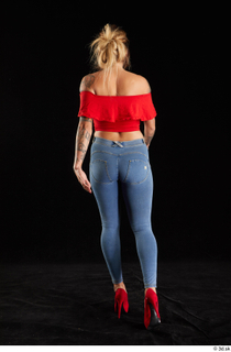 Daisy Lee 1 back view blue jeans dressed red high…